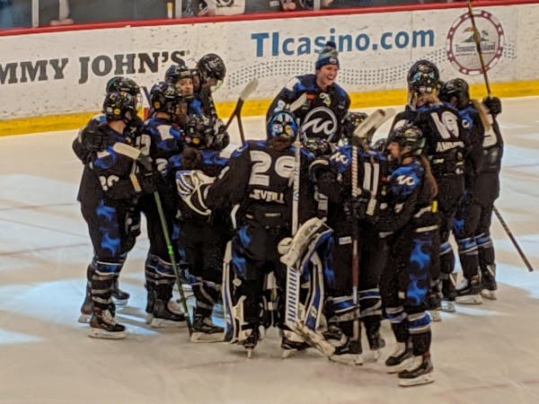 Minnesota Whitecaps players celebrated their 1-0 overtime victory over the Metropolitan Riveters at Tria Rink in St. Paul on Sunday.
