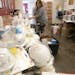Julie Anderson, a registered nurse, cleaned and sorted though certified N95 medical masks that were donated to the Minnesota Nurses Association in Mar