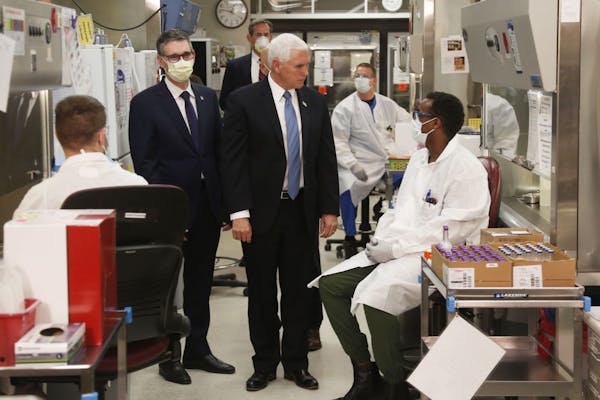Vice President Mike Pence visits the molecular testing lab at Mayo Clinic Tuesday, April 28, 2020, in Rochester, Minn., where he toured the facilities