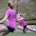 Maddie Dahlien took a shot against Bayliss Flynn, her summer soccer teammate, in a true 1-on-1 workout Monday. No other players were were on the pitch
