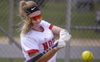 Lakeville North senior Jenna Beckstrom couldn’t help but put on her team jersey as she practiced fielding and batting with her father, Jeff, last We