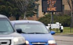 A sign put up by the Brooklyn Center Police Department reminded motorists of Gov. Tim Walz's stay-at-home order.