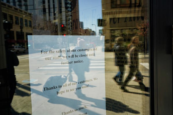 The Newsroom Restaurant on Nicollet Mall announced it was closed until further notice. A few people were still moving around in downtown Minneapolis b