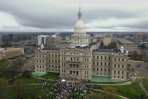 Protest at Michigan Capitol over virus order