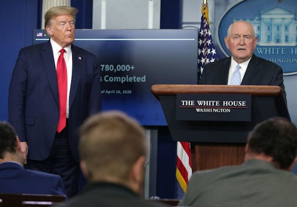 Secretary of Agriculture Sonny Perdue, right, speaks as President Donald Trump looks on during the daily briefing of the White House Coronavirus Task 