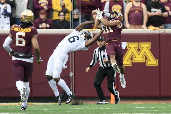 Minnesota Gophers defensive back Antoine Winfield Jr. (11) intercepted a pass intended for Penn State Nittany Lions wide receiver Justin Shorter (6).