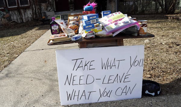 Amid the pandemic, people’s responses differ. This south Minneapolis household provided a table of food that people might need as grocery stores str