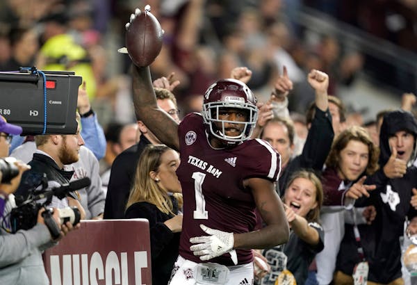 Texas A&M wide receiver Quartney Davis celebrates after catching a touchdown pass during the seventh overtime against LSU in 2018.