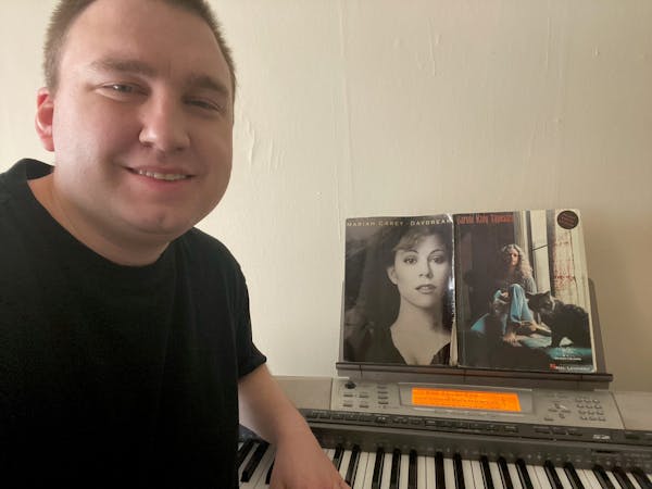 Chris Hine of the Star Tribune at his keyboard at home, along with songbooks with music by two of his favorites, Mariah Carey and Carole King.
