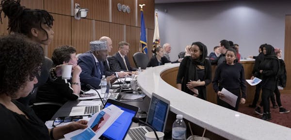 The Minneapolis school board, shown in January 2019. In a virtual meeting Tuesday night, board members voted 6-3 to approve a sweeping and controversi