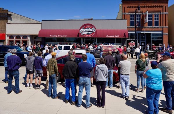 Crowds gathered outside Shady's Hometown Tavern in Albany, Minn. on Monday but the tavern decided not to reopen.