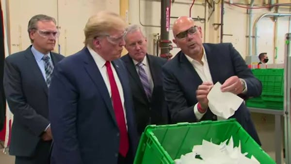 Without mask, Trump tours Arizona face mask plant
