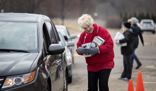 Mary Turner, president of the Minnesota Nurses Association, collected N95 masks for health care workers on March 22 at a drop of site in St. Paul.