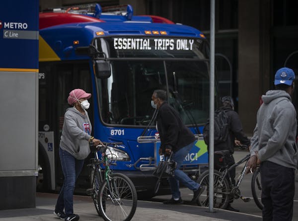 Face coverings are required on board all Metro Transit buses and trains. [Credit: Jerry Holt • Star Tribune]