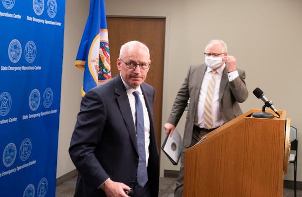 Gov. Tim Walz headed to speak Tuesday after Management and Budget Commissioner Myron Frans' remarks on the state's budget projection