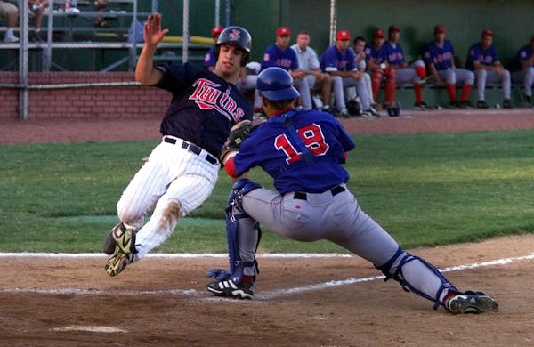 Among the Twins prospects to pass through Elizabethton over the years was Joe Mauer, here tagged out on a play at the plate in his professional debut 