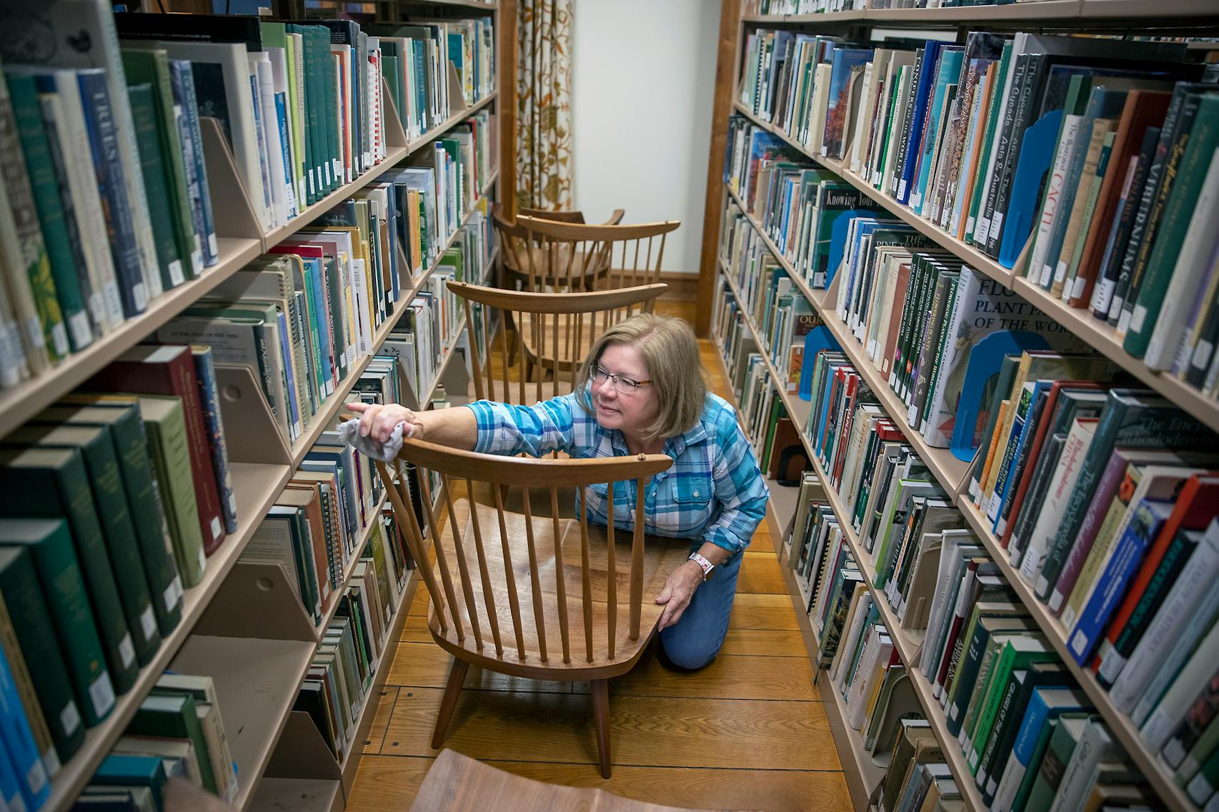 Volunteer Pamela Layton helped clean several chairs in the Arboretum's reading spaces.