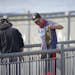 Daniel Belous, 15, held up a smallmouth bass he'd just caught at the Rum River Dam from the in Anoka Wednesday afternoon. He was released it after mea