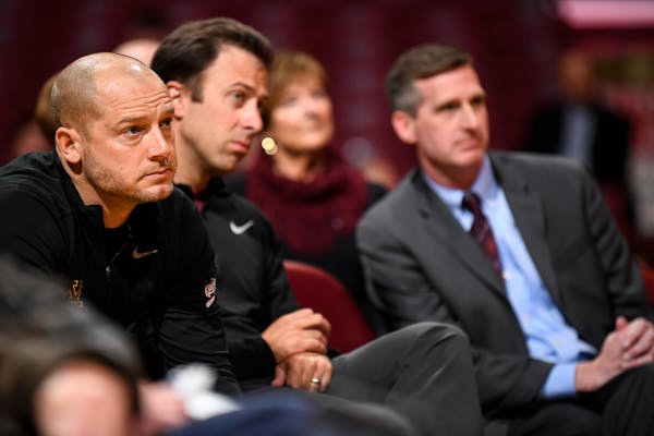 Gophers football coach PJ Fleck (left), basketball coach Richard Pitino (center) and athletic director Mark Coyle (right) are among those who took a c
