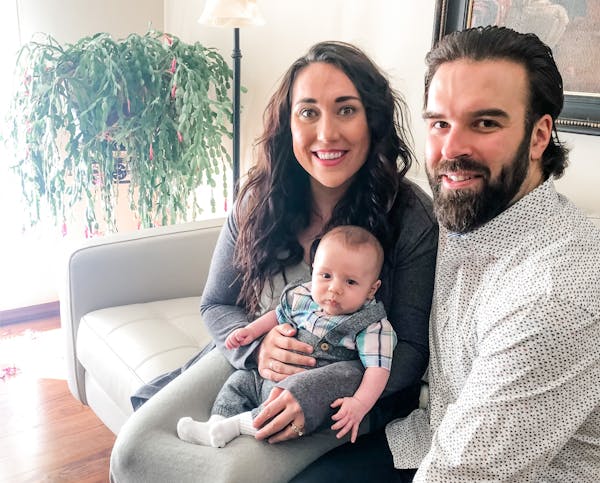 Former Minnesota Duluth defenseman Brady Lamb, right, with his wife Lizz and 3-month-old son Callaghan in Augsburg, Germany. Brady plays for the Augsb