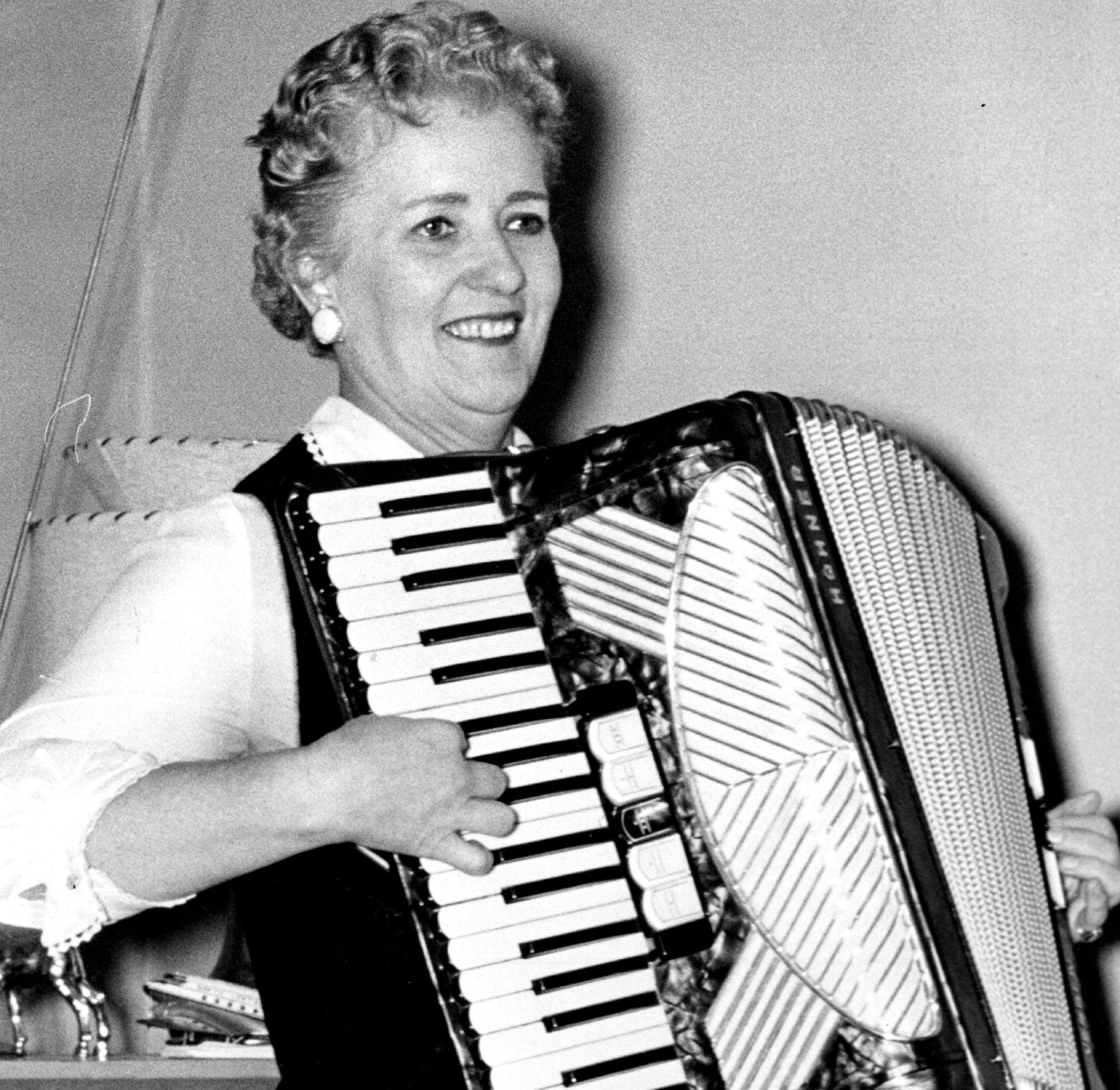 Coya Knutson, who studied English and music in school, played the accordian in 1958 while awaiting Minnesota primary results.