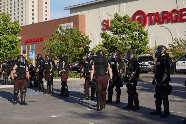 Police secured the St. Paul Midway Target after people began looting late Thursday morning.