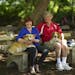 Kelly Bort, with partner Richard Ekstrum, sat at the dog park at Lake of the Isles with their Corgis.