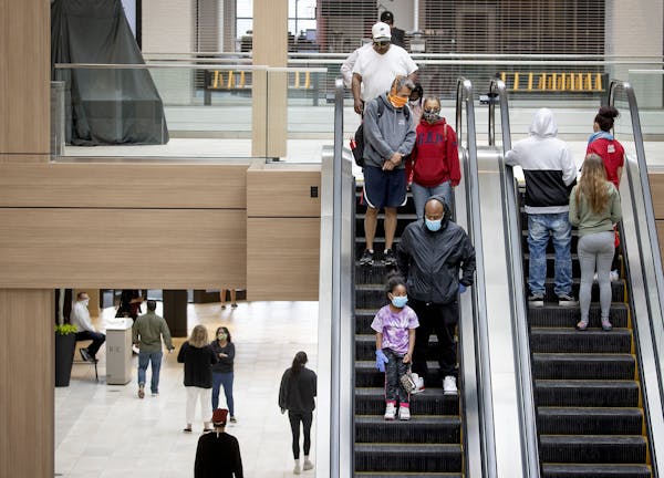 Minnesota's death toll from COVID-19 rose by 16 people on Sunday and the illness spread to 388 more people. File photo of shoppers at Rosedale Center 