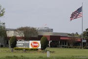 An American flag flies outside a Tyson meatpacking plant in Virginia.