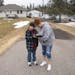 Michael Zakrajshek watched as his mom, Tawnya Heino, tried to connect to the internet in their driveway in Chisholm, Minn.