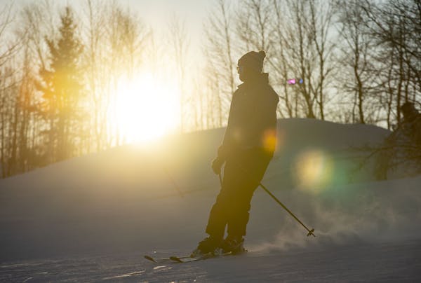 A skier made his way down a Spirit Mountain run at sunset on Dec. 17, 2019.