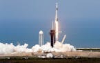 A SpaceX Falcon 9, with NASA astronauts Doug Hurley and Bob Behnken in the Dragon crew capsule, lifts off from Pad 39-A at the Kennedy Space Center in