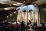 At Transfiguration Catholic Church in Oakdale, parishioners were able to attend a service by Father John Paul Erickson on Wednesday as pews were close
