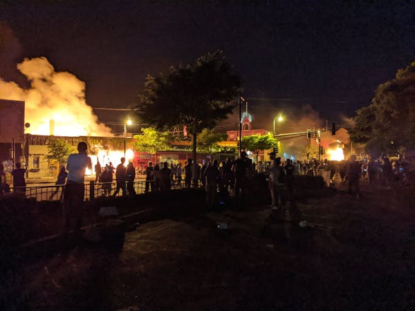 Minneapolis police precinct engulfed in flames amid protest
