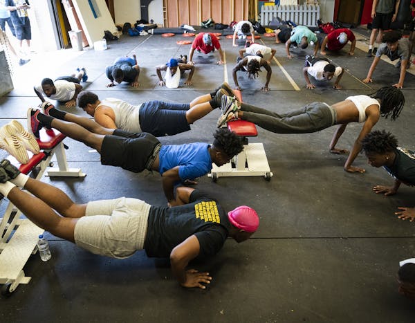 Members of the Minneapolis North High School football team worked out on Monday, the first available day of summer workouts with coaches, in the schoo