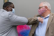 Duluth Human Rights Officer Carl Crawford greeted Minnesota Gov. Tim Walz with an elbow bump last month.