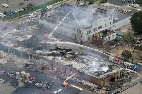 A 190-unit apartment building under construction, at bottom, was burned to the ground at 29th St. and 26th Ave. S.