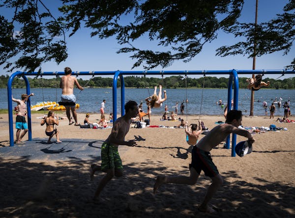 Young people enjoyed the beach at Lake Nokomis on Wednesday, a hot summer day.