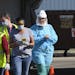 Medical workers administered drive-up COVID-19 tests Saturday outside the Sanford Worthington Clinic on April 18 in Worthington, Minn. State data have