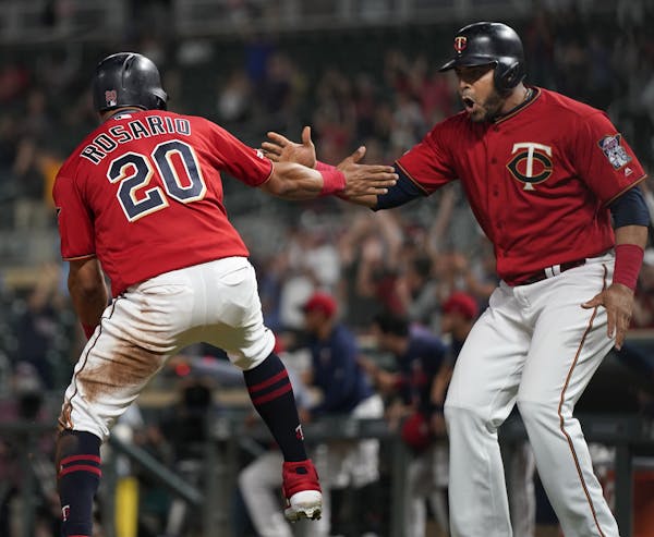 Eddie Rosario and Nelson Cruz celebrated after a Twins’ victory in September.