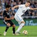Jan Gregus (8) of Minnesota United FC controlled the ball against a Sporting Kansas City defender in a Sept. 25, 2019 match at Allianz Field in St. Pa
