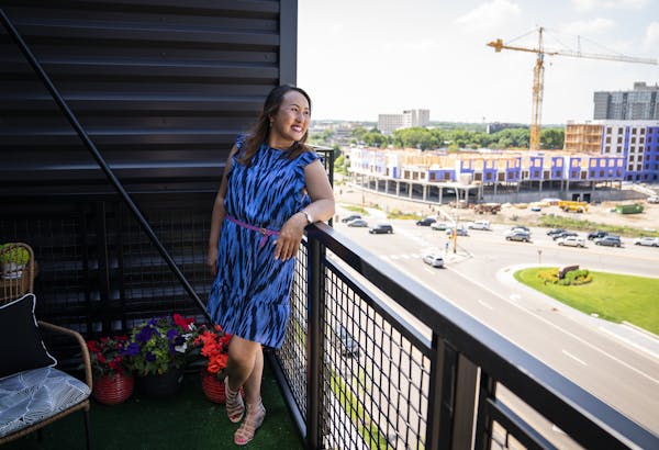 Jeanie Kang on a balcony at Aria in Edina, where she rents an apartment and enjoys its proximity to Southdale.