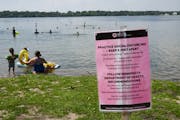 A social distancing sign at Lake Harriet's South Beach in Minneapolis on Thursday afternoon ahead of the July 4th weekend.