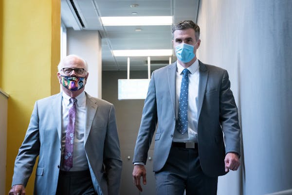 Former Minneapolis police officer Thomas Lane, right, walked out of the Hennepin County Public Safety Facility on June 29 afternoon with his attorney 
