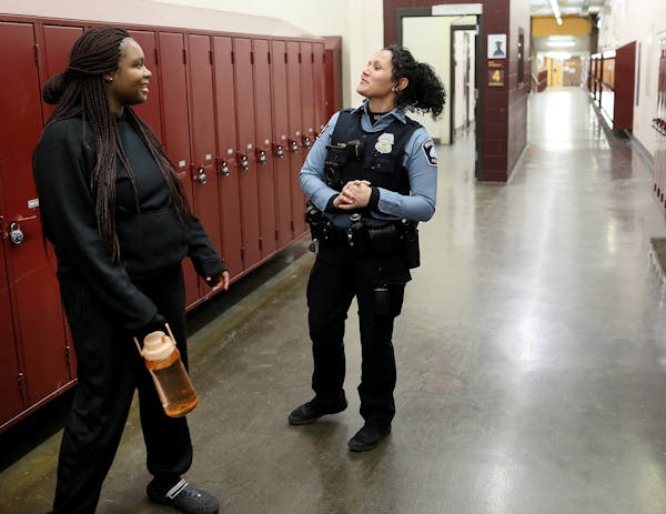 Darnella Frazier, left, chatted with school resource officer Drea Leal at Minneapolis Roosevelt High School in January 2019.