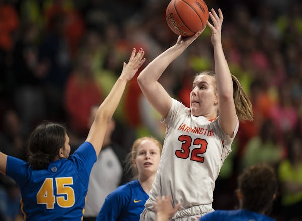 Farmington center Sophie Hart (32) put up a shot in the first half of the Tigers’ Class 4A semifinal game against St. Michael-Albertville on March 1