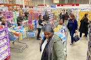 Shoppers flooded Costco in Maple Grove March 13. Costco became the first national retailer to stop selling its half-sheet cake that is so popular for 