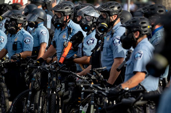 Police gathered May 27 as protests continued at the Third Precinct police station in Minneapolis after the death of George Floyd in police custody.