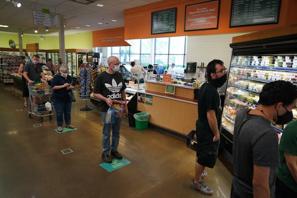 Mississippi Market in St. Paul has made changes since the COVID-19 pandemic began, including requiring masks, marking the floor with social distance g