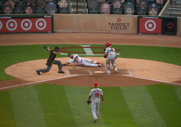 Twins second baseman Luis Arraez was safe scoring on a Byron Buxton single in the second inning.